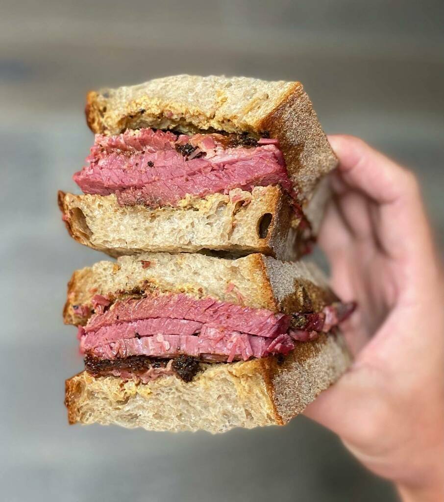 My fave Pastrami <a href="/uglydrum/">Erik Black</a> on a @bubandgrandmasbread. Perfection!

🏆On the 'Must Try Sandwiches in LA' guide (guide tab). Where's your fave Pastrami??

—-
Pit Smoked Pastrami Sandwich 
📍Ugly Drum (pop up at Bludso's)
#foodmento 💛
.
.
.
.
.
#forkyeah … instagr.am/p/CKxa89vrTJu/