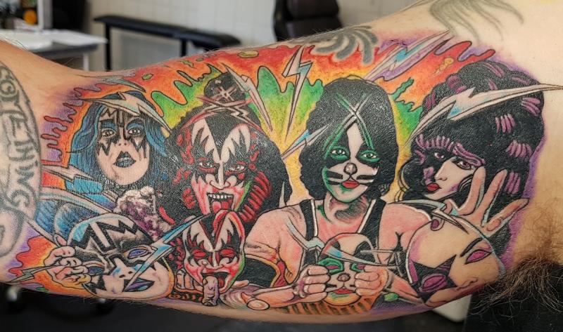 kiss's tweet photo. Celebrating International Face &amp; Body Art Day with these awesome #KISSTattoos! #KISSARMYROCKS https://t.co/azMgGT3sCh