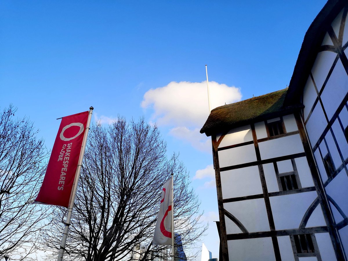 A bright blue winter sky above the exterior of the Globe Theatre.