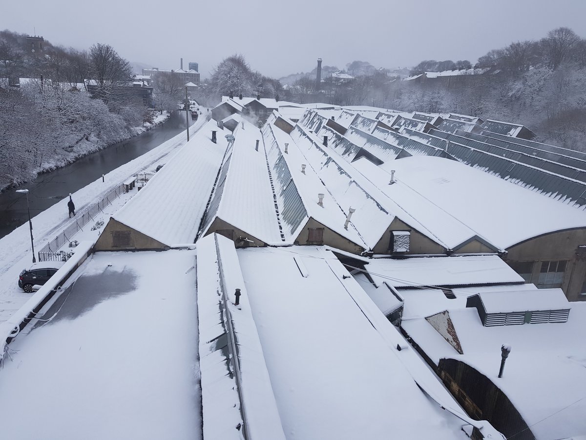 McNairshirts's tweet photo. A snapshot of the mill today in #slawit. Whilst the canal freezes outside, the shirt-making goes on inside, even if it does mean walking to work. Our production is starting to catch-up again. Thanks for all your patience. 🙏 #Yorkshire  #madeproper https://t.co/oV9EJfvVkL