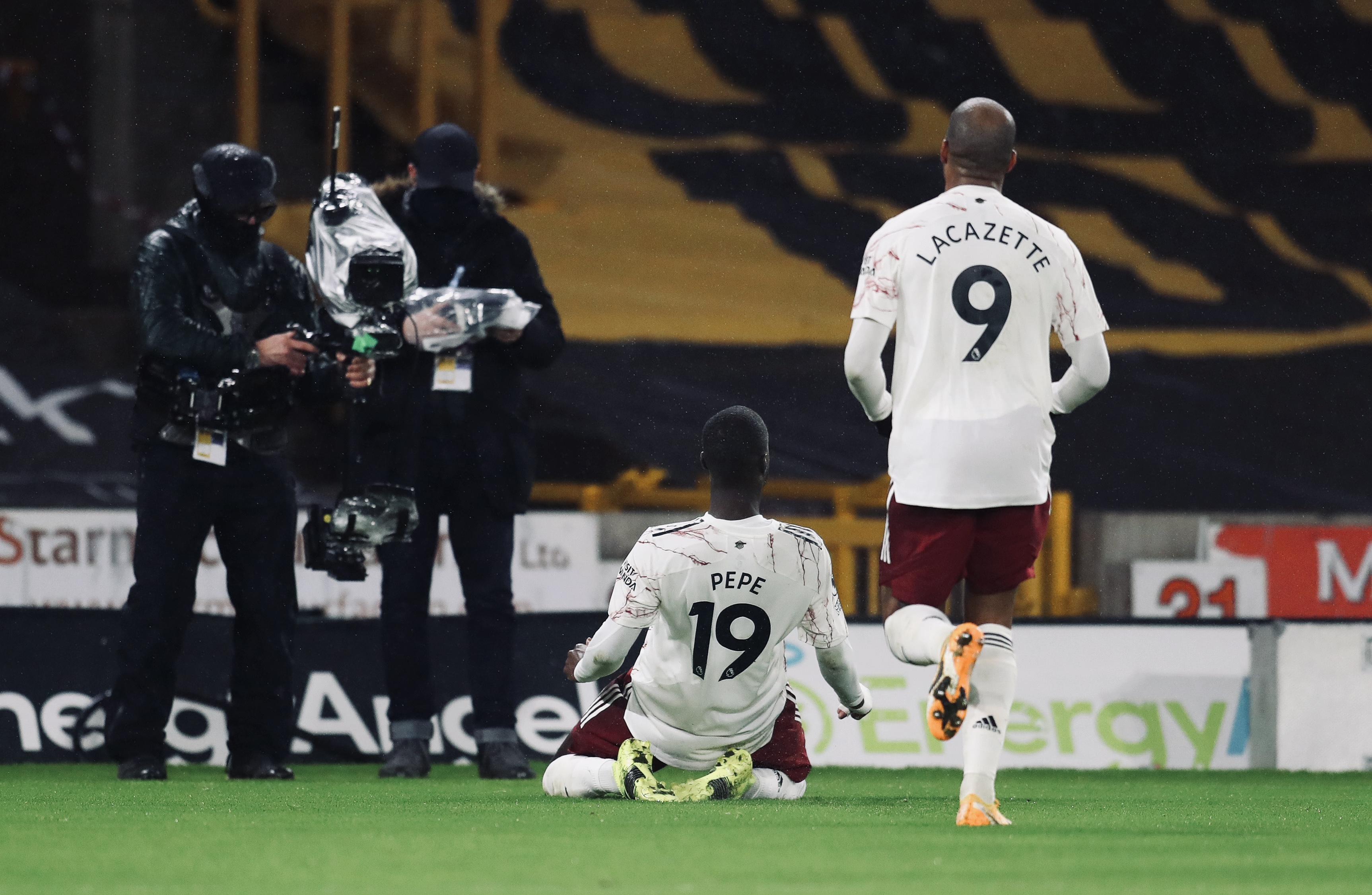 Nicolas Pepe slides in front of the cameras at Molineux