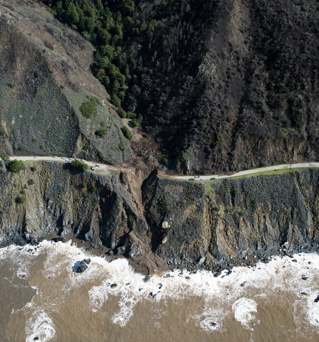 The storm that hit California’s coast between Jan. 26 and 28, 2021, blew out a portion of Hwy 1 near Big Sur. On Saturday, a USGS reconnaissance flight snapped this dramatic photo above the Rat Creek drainage showing the debris flow.