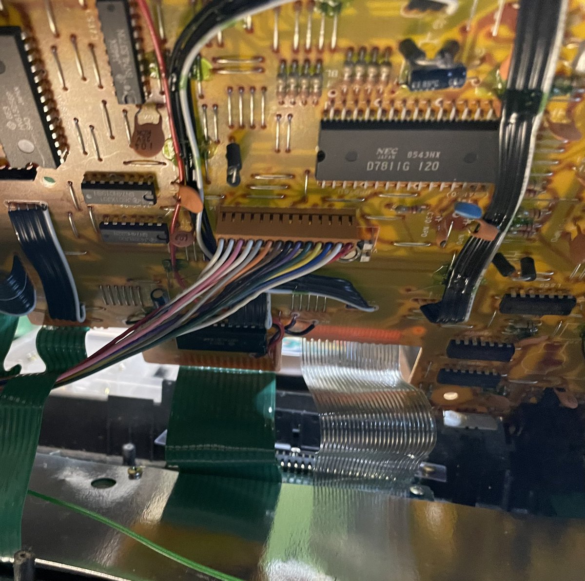 Getting kinky and suspending the first layer of boards to make this easier to work on.Stole this idea from the guy who made the mod kit, my only addition is using a mic stand to suspend them from.That brown connector is what we’re after for the display.