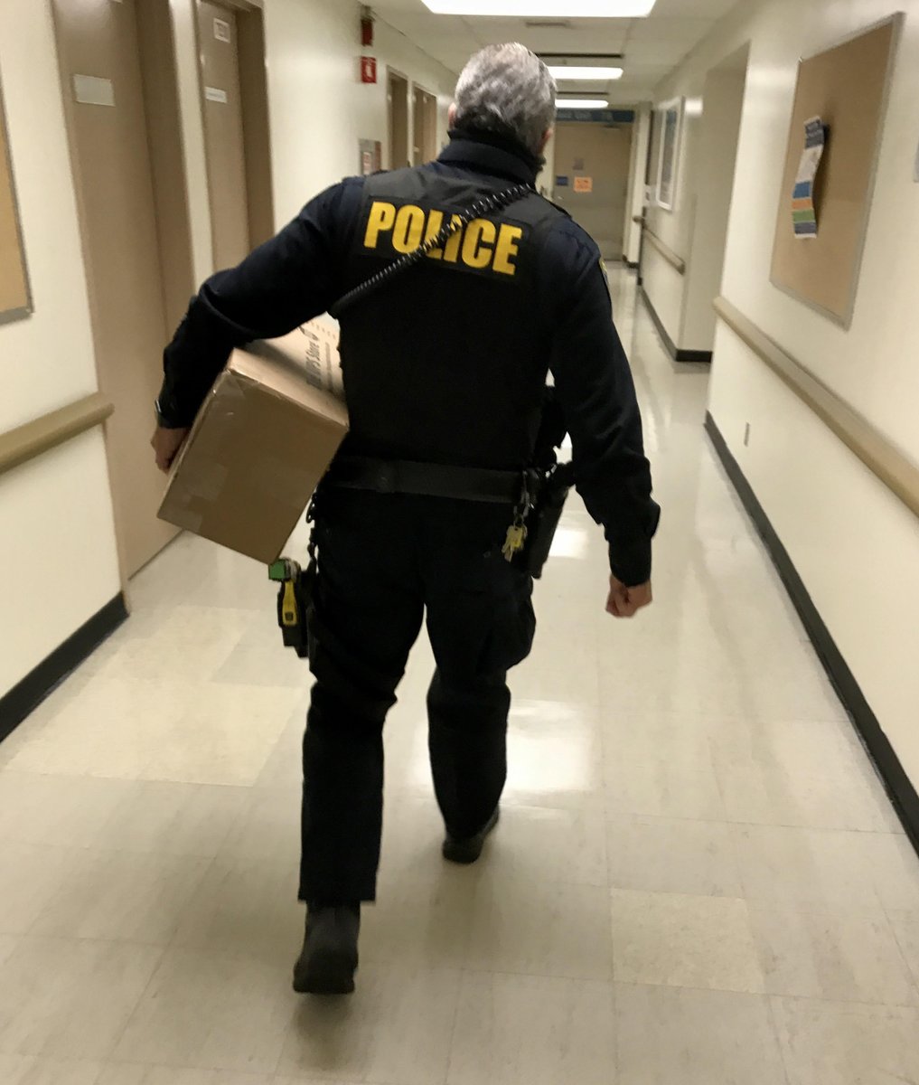BART PD Officer Eric Hofstein delivering a care package to Dell (pseudonym) at a local hospital. Dell is recovering after years of being unhoused and suffering mental illnesses.