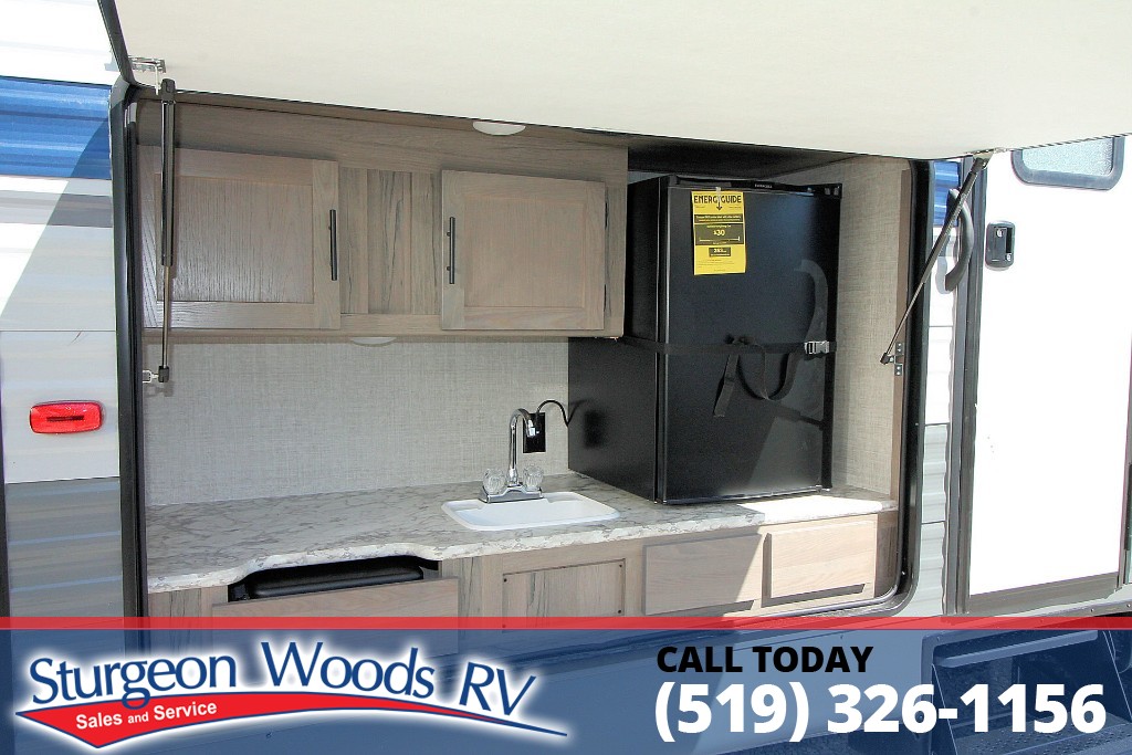 The awesome outdoor kitchen is just ONE of the great features on this Gulf Stream Trailmaster 321TBS! 2 slides opposite the door-side provide an unexpected amount of space inside - bunk room and great living area! Check out this quick video for more: ow.ly/vrHR50Dqryr