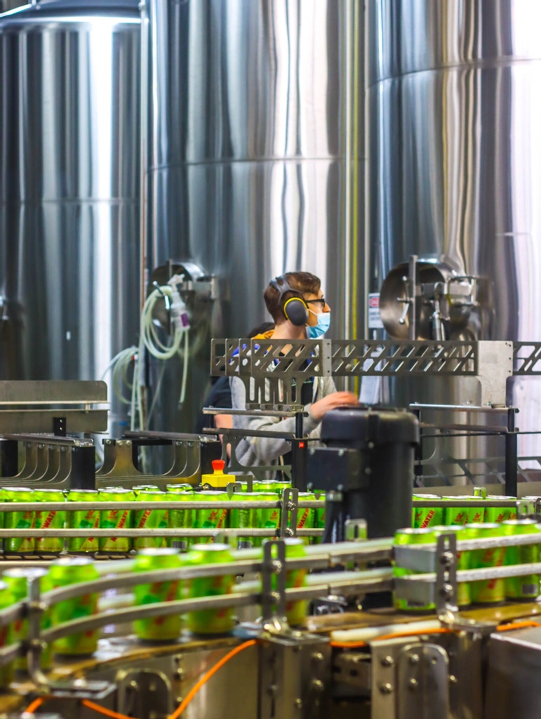 Working on the canning line ain't easy, but our packaging team is always up for the challenge.