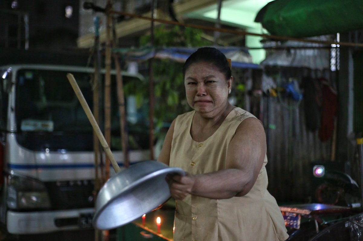 soezeya's tweet photo. A woman cries as she bangs a pan the way they traditionally do it to drive away evil spirits, during protest against military coup in Yangon, Myanmar February 3, 2021.  Pix from Kyaw Swar Tun https://t.co/MynSz8st44