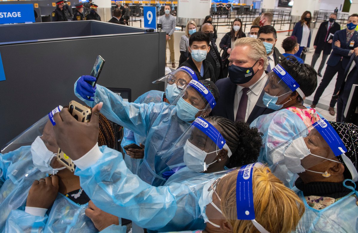 frankgunnphoto's tweet photo. Ontario Premier @fordnation  is surrounded by selfie seeking nurses at the COVID19 testing centre in Terminal 3 at Pearson Airport in #toronto #covid19 https://t.co/oACjEqzYST