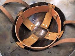 Most medieval helmets (not skullcaps) would not directly sit on the skull, but have a good distance to the bone and a system of straps and suspenders on the inside, to provide a free floating metal sphere around the head, which can absorb blows