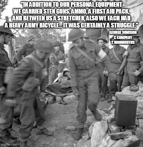 George served in 2 Mons, and described arriving in Normandy as part of their Cycle Company.Such juggling was pretty common.Here four SBs move one casualty, more usual behind the lines. /10