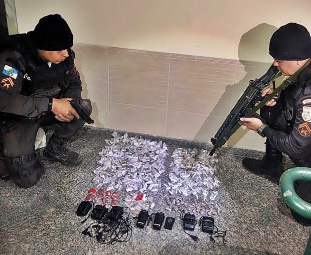 Rio's Military Police make sure the drugs don't run away by holding them at gunpoint