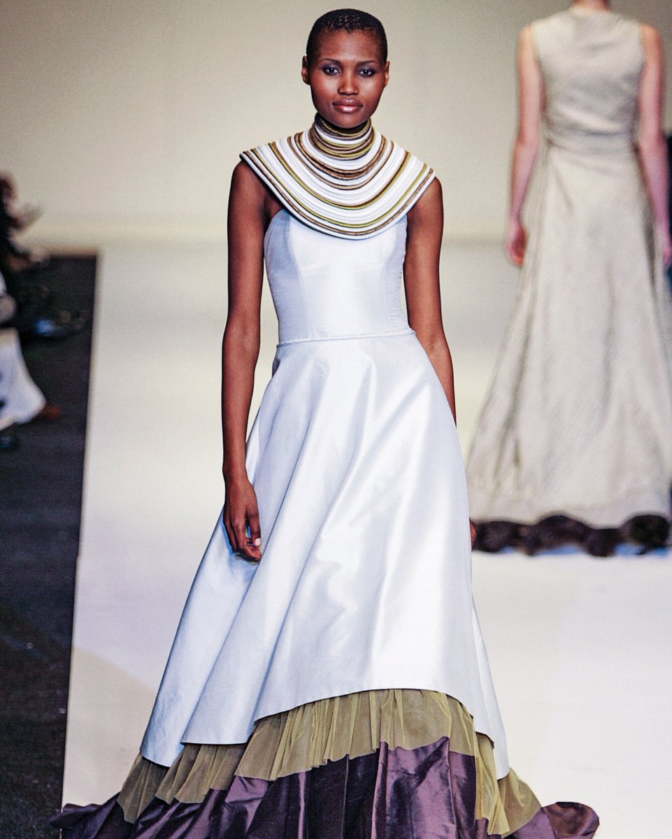 #SAFWPlaybook - <a href="/LUNARCLOTHING/">LUNAR</a> SS05/06 'Africa Dreaming Collection.

African Queen Dress - Silk with mesh trim and worn with a neck-piece made out of individual strips of piping worked together by hand. 

#SAFW #SupportLocal