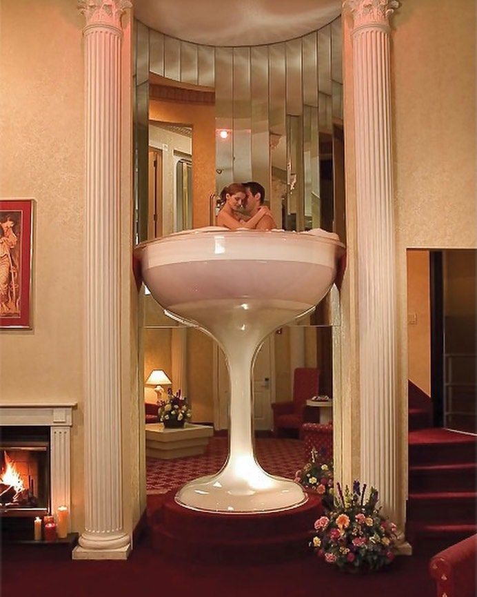 7-foot glass champagne tower whirlpool bath from Pocono Palace Resort in Pe...