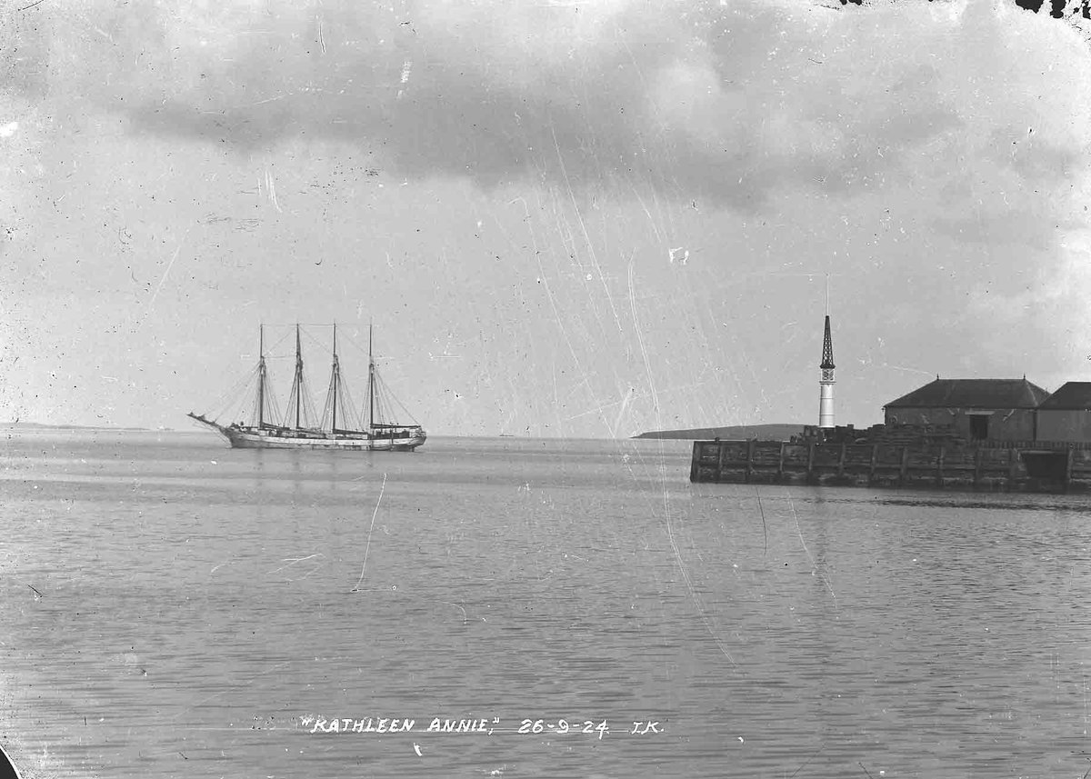 The Kathleen Annie was a four-masted schooner on her way from Bremen to prohibition America when she ran aground off Eday in September 1924. These photos by Tom Kent shows her in Kirkwall Bay shortly before her grounding, then a few months later as her cargo was being salvaged.