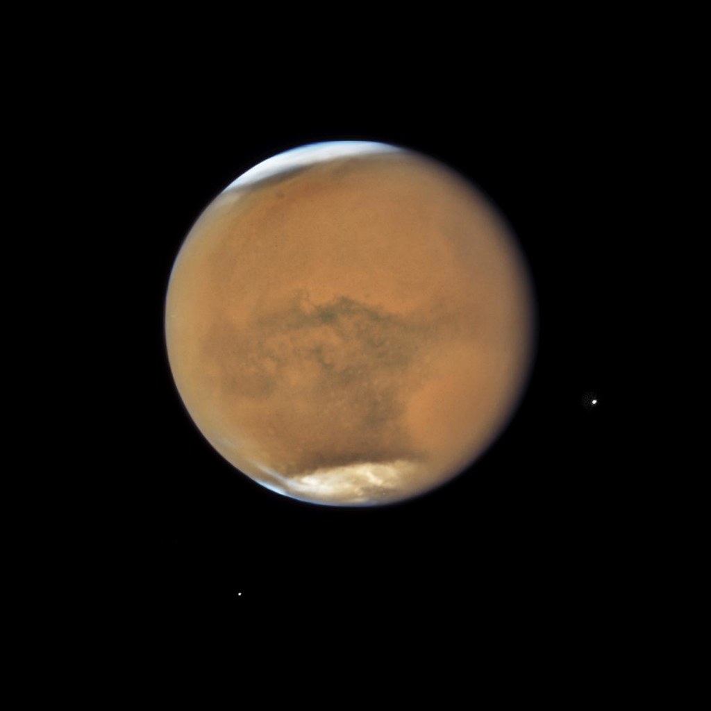 NASAHubble's tweet photo. We’re just a couple weeks away from the @NASAPersevere rover’s landing on Mars! 🚀

Learn more as the #CountdownToMars continues: https://t.co/mPIozkqV6b 

This Hubble image of the Red Planet was taken in 2018 and includes the moons of Mars, named Phobos and Deimos. https://t.co/27qgj12PYU