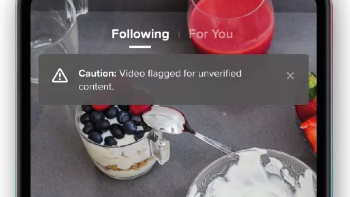 Second up: language.It’s important not to alienate people. First, TikTok opts for ‘video flagged’ to downplay who flagged it. It then avoids judgemental language by opting for ‘unverified’, preferring to say what it isn't, rather than making a claim about what it is.
