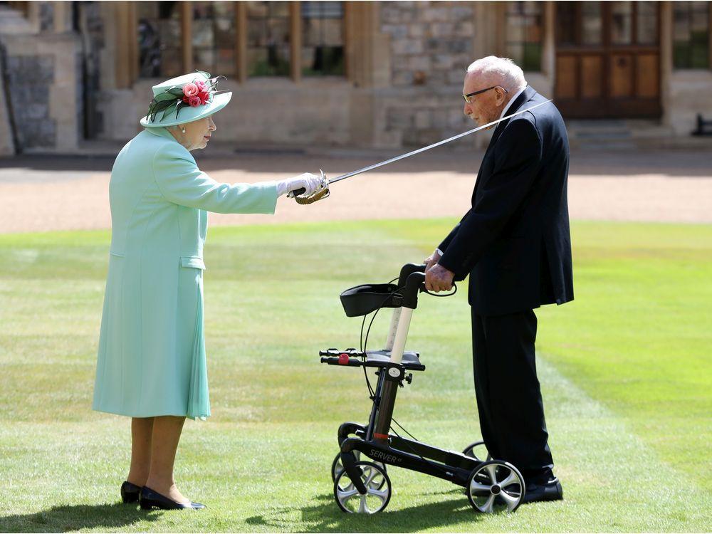 With nationwide applause, Britain mourns 'hero' Captain Tom Moore