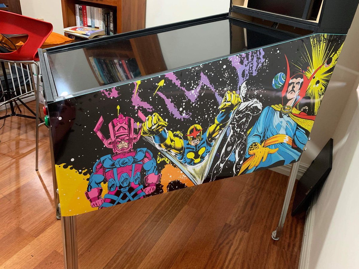 m_halse's tweet image. Pinball machine update. Printed my first mockups of the art for the sides. Really happy with how it turned out! And it's not even the final product (sticky taped the paper to the sides 😅) #virtualpinball #pinballart