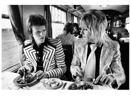 David Bowie and Mick Ronson, Train to Aberdeen, Scotland 1973. Photo by Mick Rock.