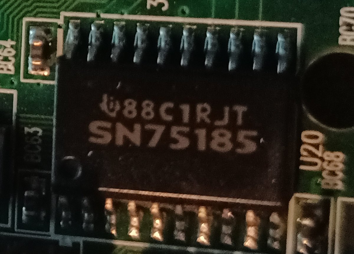 Near that chip we've got a TI SN75185, which is an RS232 transceiver.