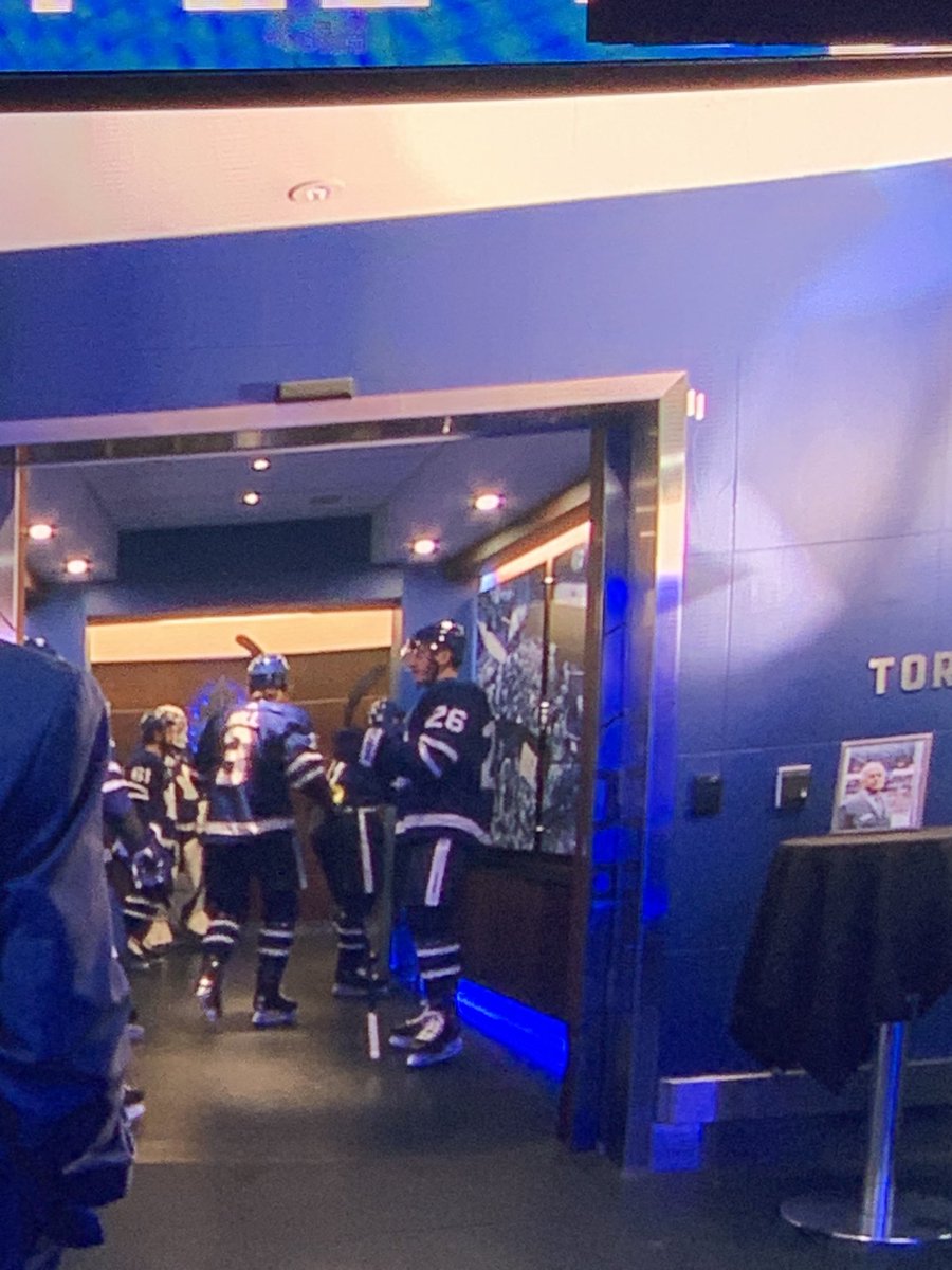 kristen_shilton's tweet photo. #Leafs honouring late usher Vic Braknis with a photo next to the dressing room https://t.co/hjzzZWH93g