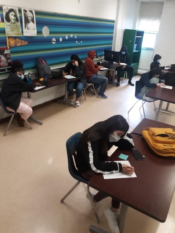 English students adding ideas from their reading to STAAR prompts.