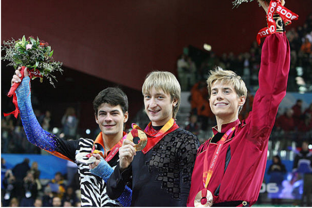 2006: completion of the first olympic quad in 2000s is complete, and the current fs costume trends reflect the eclectic, bright, and textured style of this y2k era. this is the peak of the elaborate costumes in skating, fabric volume will decrease but the bright colors remain