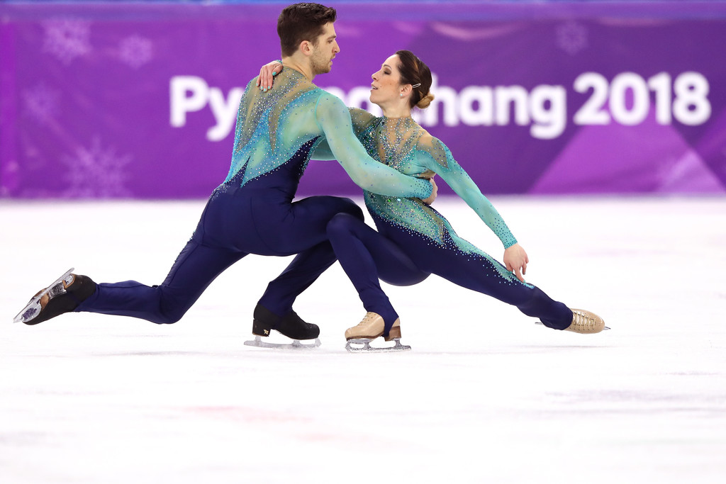2013: pairs skater Aljona Savchenko wears her iconic bright pink bodysuit for her "Pink Panther" program, inspiring a generation of pairs skaters to favor sleek, bold, and athletic bodysuits that had since fallen out of style since 2006.