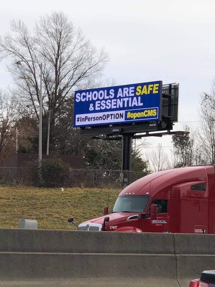 qthecoffee's tweet photo. Well, two of these beauties appeared today on I-77 and Independence Blvd! Don’t know who did it, but you are my HERO! It will be a little more difficult removing these like those did our signs! @CMSboard @wcnc @Hunt_Saenz @gregolsen88 #InPersonOPTION #openCMS https://t.co/phi7ZDVuES