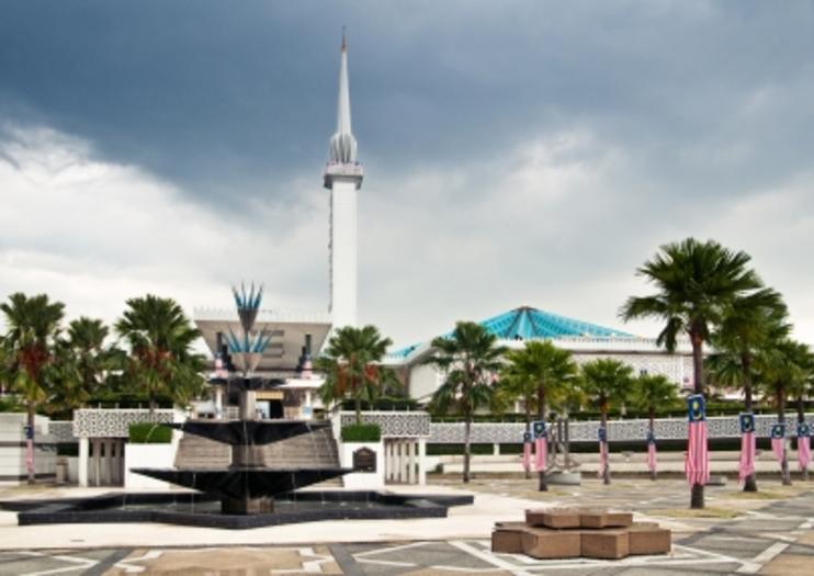 Tonight's site is the National Mosque of Malaysia in Kuala Lumpur. It's located in 13 acres of gardens & has a 240 ft tall minaret. It was first opened in 1965, then underwent renovations in 1987 which included having the original pink concrete roof clad in green & blue tiles.
