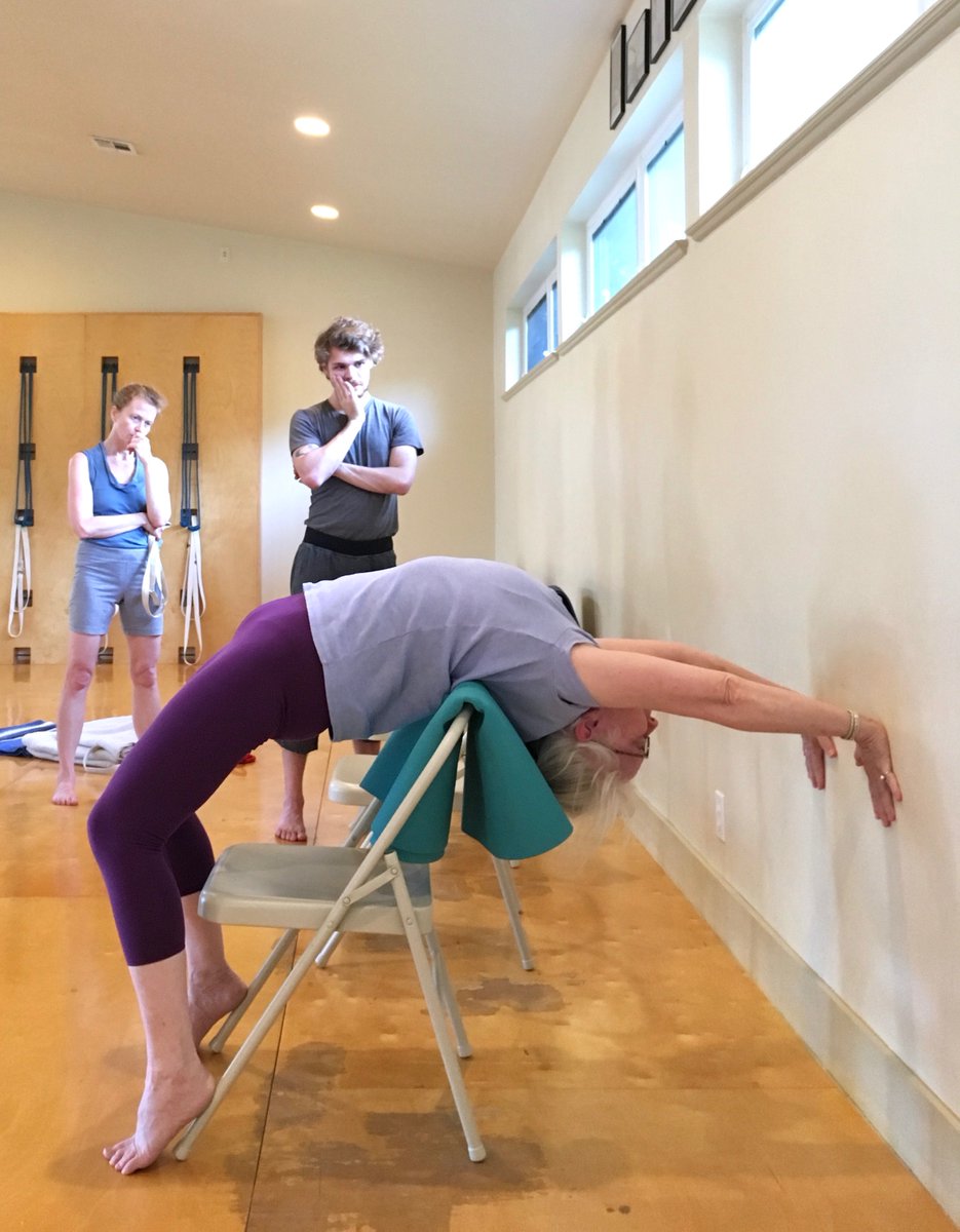 Stabilize your chair! Belt the top to the back rung and the chair won't  fold. We used it for Pincha Mayurasana with the chair's back legs to the  wall, front of seat, image size:935x1200