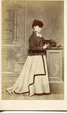 By 1868 the crinoline cage had started to be flattened at the front, while maintaining volume in the skirts at the back. This can be clearly seen in KLNTY2020.171, which dates from 1868-70 and in KLNTY2020.174. [4/20]