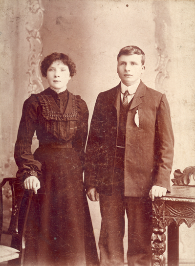 Erin Petts & Bill Hendry [TY1989.150] are probably pictured 1901-5 as she hasn’t got the hair style needed to support the big hats which were popular later in the Edwardian period. Her sleeves are full on the lower arm which also suggests the 1st few years of the century. [17/20]