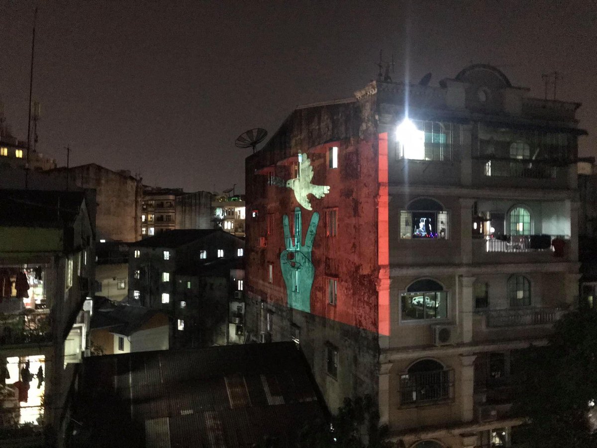 Filmmaker friend <a href="/myominkhin/">Myo Min Khin</a> projects recent protest art on to an apartment building in downtown Yangon 😮😮😮✊✊✊