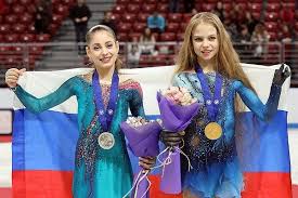 2018: Olga Ryabenko, costume designer for all of Eteri Tutberidze’s students, evolved her own style this year into one with intricate appliqués, sequins, and crystals upon layers of fabric, seen in Evgenia Medeveda, Alexandra Trusova, Aliona Kostronaia, and Alina Zagitova