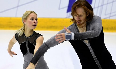 2018: Vera Wang’s monochromatic abstract works for Nathan Chen at the 2018 olympics inspire a movement for ultra-paired down costumes in the mens disiplie, but Wang's impact can seen below in singles skater Stephen Goglev and pairs Tarasova and Morozov.