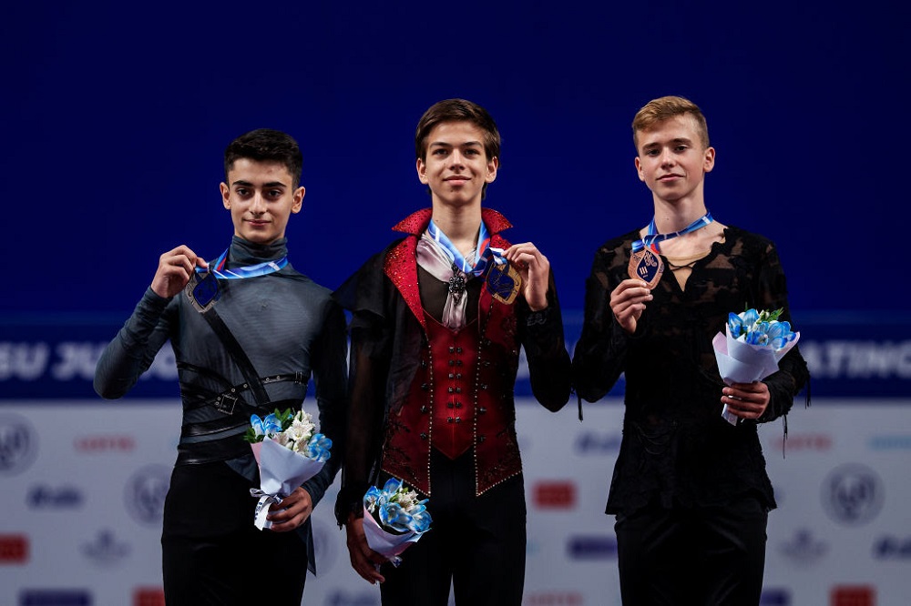 2020: Looking at the picture of the 2015 worlds podium to now, mens costumes have become much more simple, athletic, and monochromatic in the last five years, echoing the current mentality of athleticism in mens skating. details have been paired down and color schemes darker