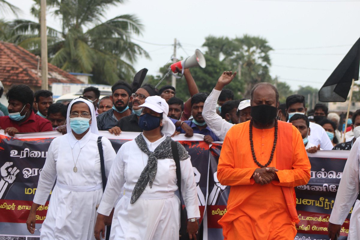 TamilGuardian's tweet photo. Pottuvil to Polikandi protesters reached Mullivaikkal amidst heightened security presence and intimidation. They stopped off at the Mullivaikkal memorial to pay their respects. https://t.co/XavSHKRsvX