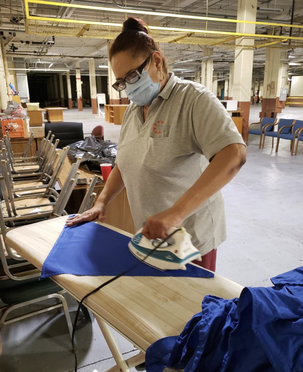FLASHBACK FRIDAY. The Chimes team worked together to make sure everyone was safe. Bunny ironed cloth dinner napkins that would be folded into face masks for Chimes custodial crews at Aberdeen Proving Ground.