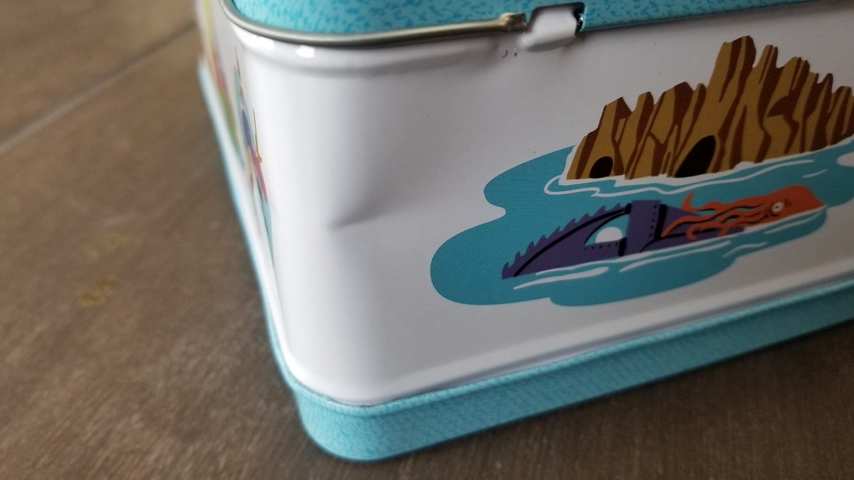 K0STK's tweet photo. @DisneyD23Help We were excited to receive our 2021 Gold Member gift. But are a bit disappointed by how the lunch box was dented in shipment https://t.co/lrNIEEqaDJ