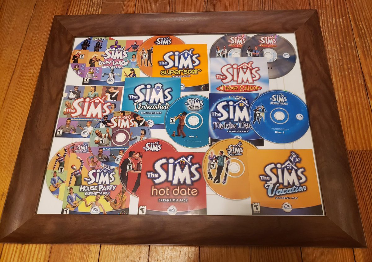 SimmerChase's tweet photo. Happy 21st my fellow Simmers and for those of who remember the beginning, here's an idea for commemorating your OG Sims Legacy Collection. My most prized possession now. #sims #Sims4 #sims21st #TheSims21st #TheSimsanniversary #thesimsframed #showyourdiscs #simscollection #TheSims https://t.co/8u35vUEYE6