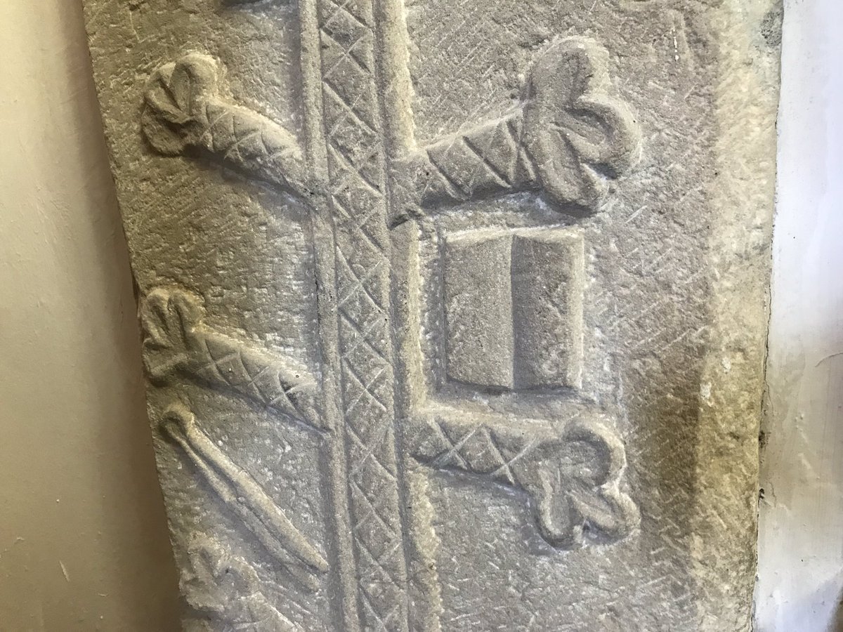 For example, at St Andrews, Finghall*, Yorkshire, a cross slab features a book and shears. Shears also feature on a slab at Bakewell. This emblem may have denoted that the deceased was a cloth-worker or wool-merchant.4/