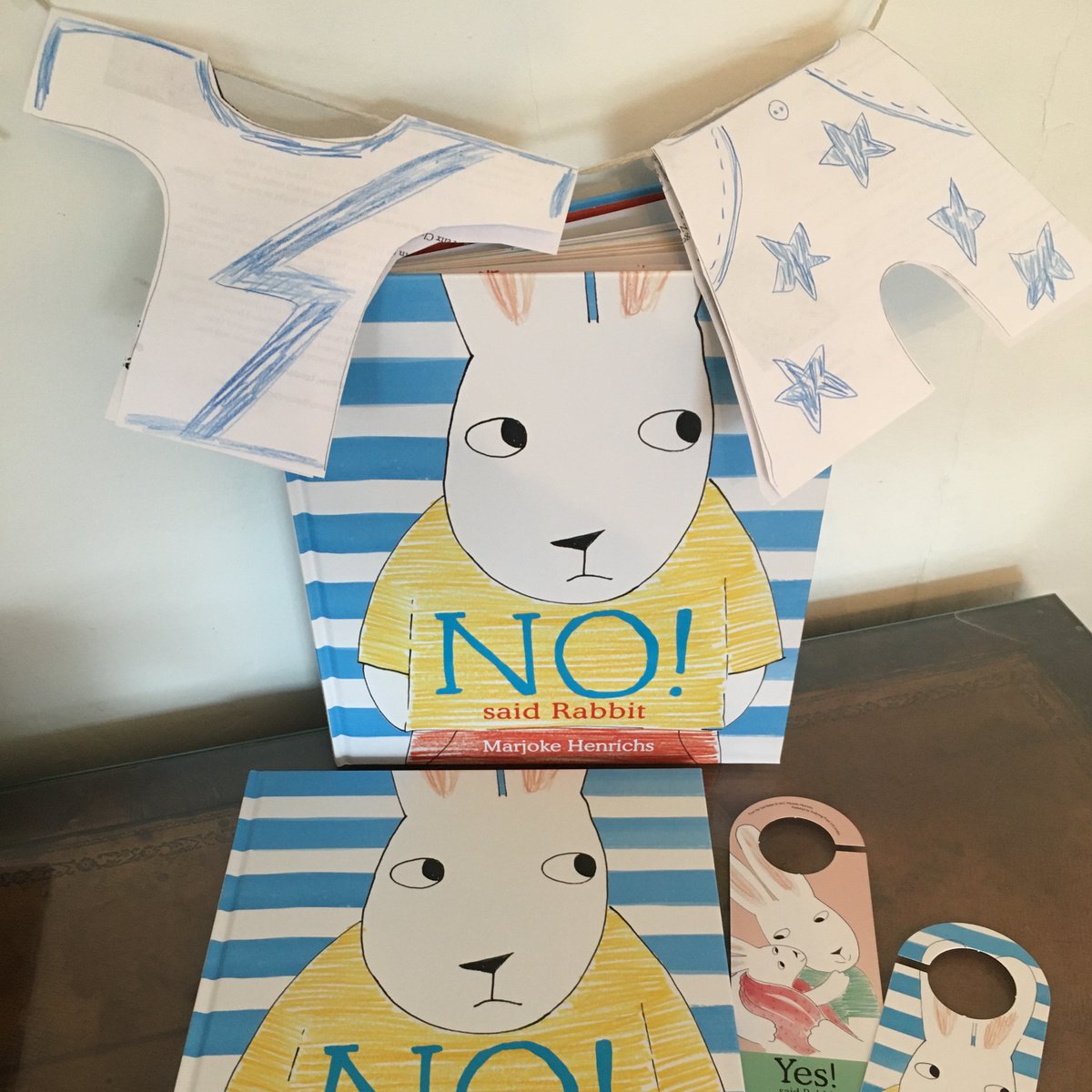 Scallywagpress's tweet photo. Very proud of my sensational washing line bunting made at today's launch of #NoSaidRabbit - thanks @chickenandfrog for hosting! You can still watch the reading and activity at https://t.co/XDMZfzchtT. Get your copy of @marjokehenrichs new book at Chicken &amp; Frog!  @AngliaMACBI https://t.co/1M6nBTwTy0