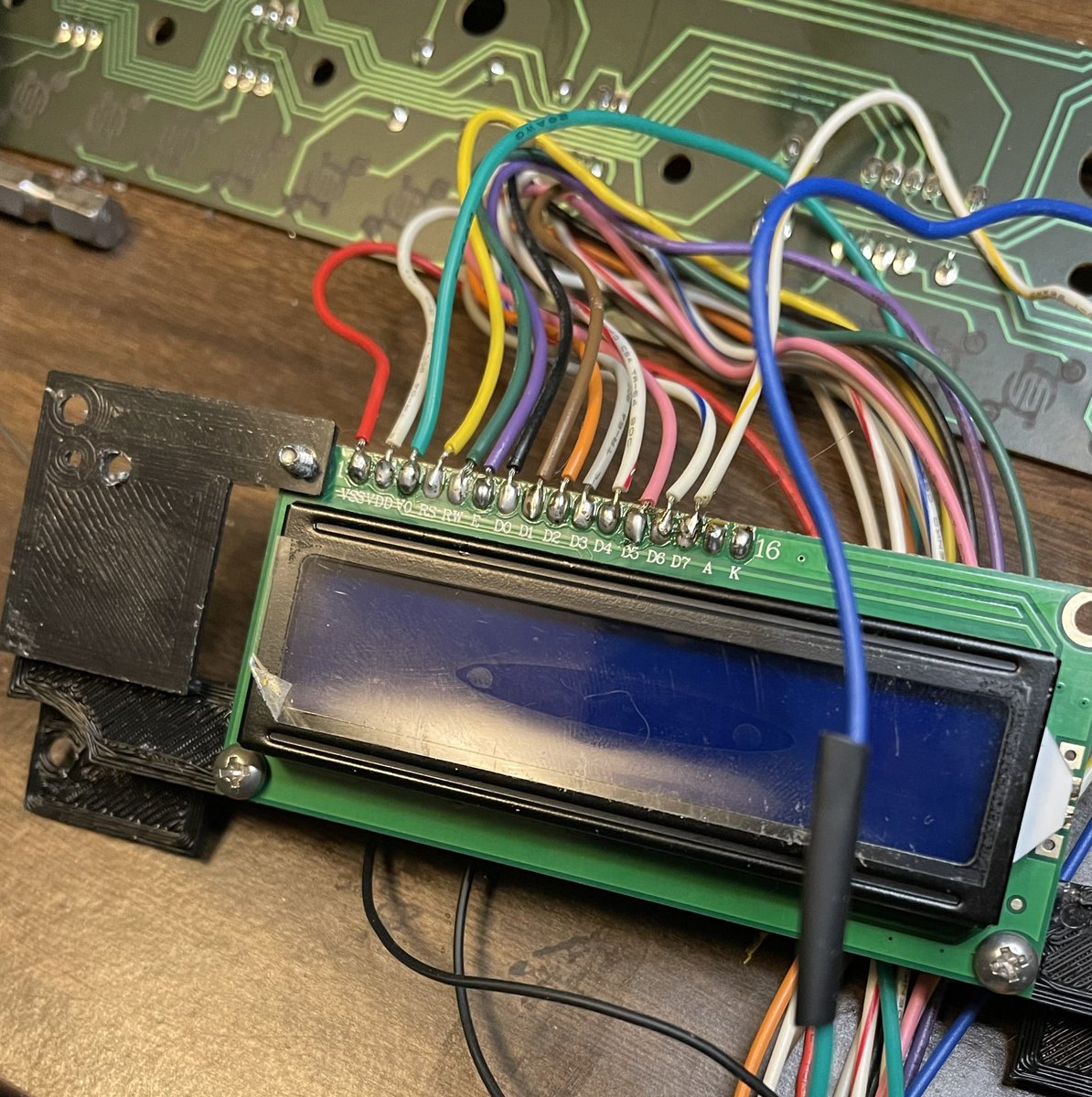Screen wired up! Easy enough, Pins 1-14 on the new board line up with the 14 wires from the old screen (same order).Pins 15 and 16 are jumpered to pin 2 and pin 1 to provide power and ground connections for the backlight (respectively).