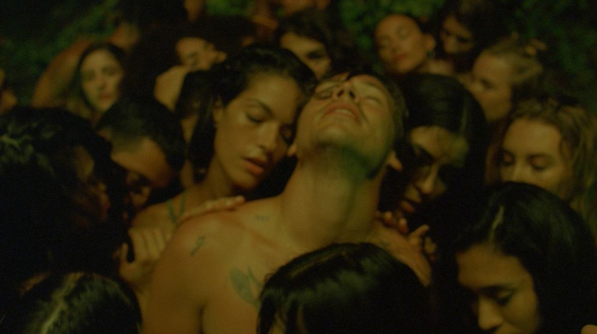 In the music video Harry is surrounded by women AND men touching him.