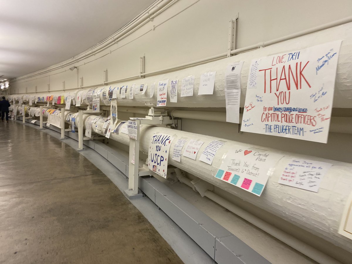 SYMBOL OF GRATITUDE: The reminders of trauma have been met with incredible kindness and compassion. The attacks, meant to break our democratic process, have instilled a newly strengthened resolve to protect it. 100s of signs thanking Capitol Police line tunnel under the Capitol.