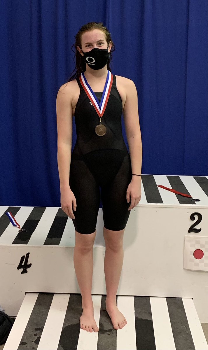 Emily Cobb on the podium for the 500 Free, 6th place.  Jenabelle Justice 7th and Madison Essary 18th.