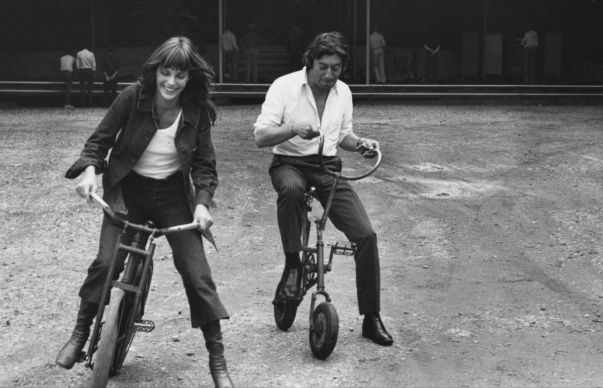 Jane Birkin and Serge Gainsbourg on bikes.