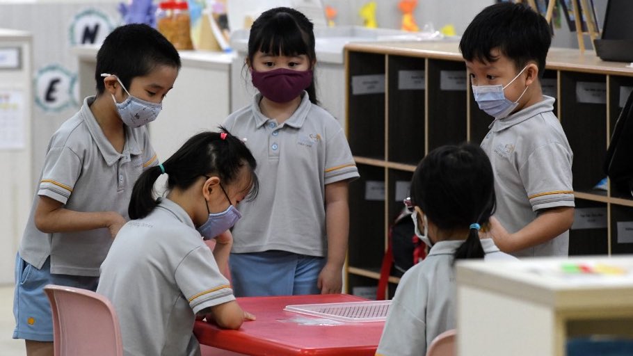 Young children wearing masks in school in Singapore.  #bced  #bcpoli