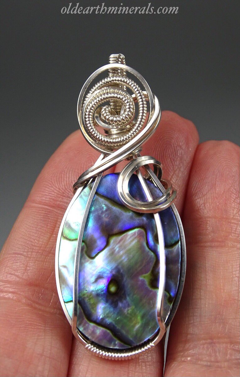 Abalone Shell Cabochon Wire Wrap Pendant - Sterling Silver. $45 plus shipping. 5.5 x 2.3 cm.
oldearthminerals.com
.
 #abalonejewelry #abalonenecklace #abalone #wirewrap #jewelry #abalonependant #necklace #necklaces etsy.me/376F1Fl